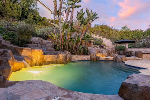 pool with a patio area