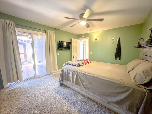 bedroom with ceiling fan, access to outside, carpet, and visible vents