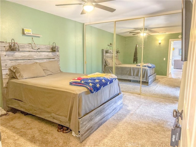 bedroom with a closet, carpet flooring, and a ceiling fan