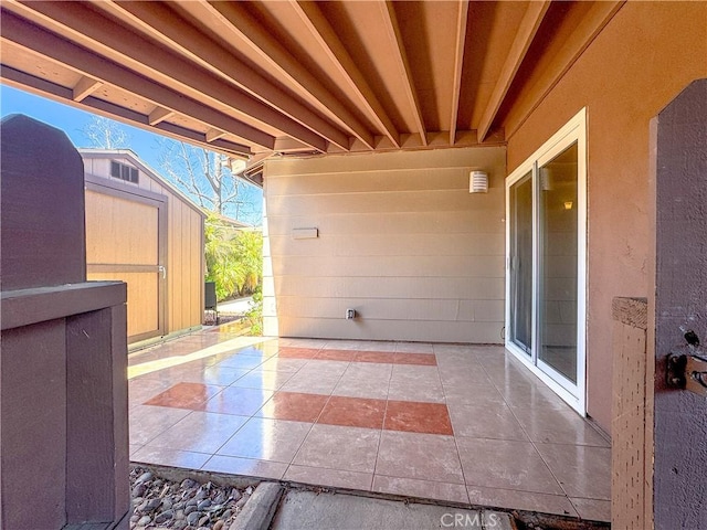 view of patio / terrace with a shed and an outdoor structure