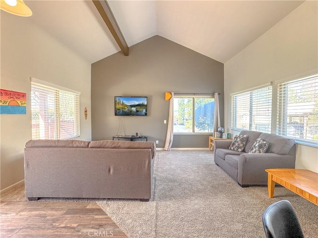 living room featuring high vaulted ceiling, beam ceiling, light carpet, and baseboards