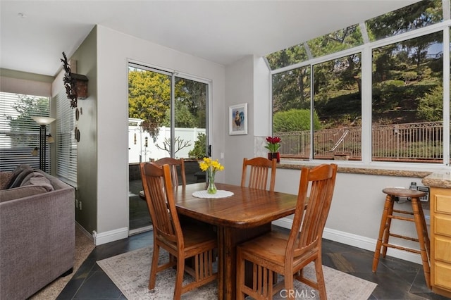 dining area featuring baseboards