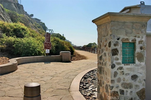 exterior space with fence and a mountain view