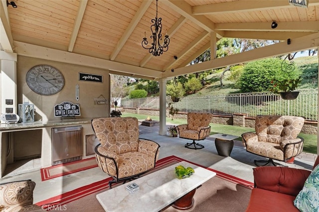 view of patio / terrace with a gazebo, an outdoor kitchen, and a fenced backyard