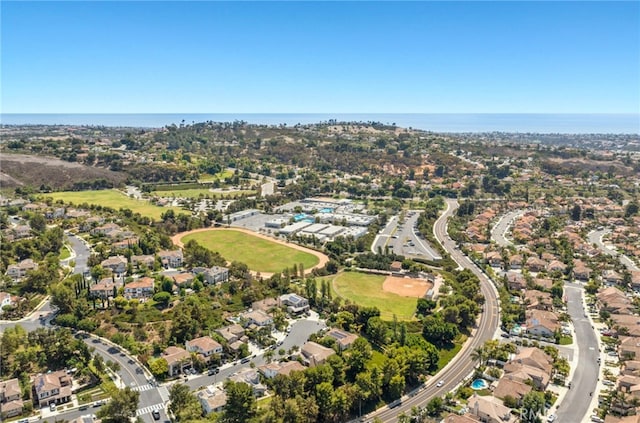 birds eye view of property with a residential view and a water view