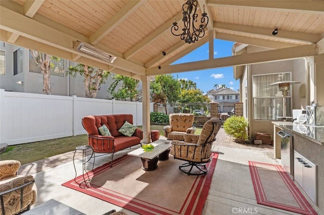 view of patio / terrace featuring a fenced backyard, outdoor lounge area, and a gazebo