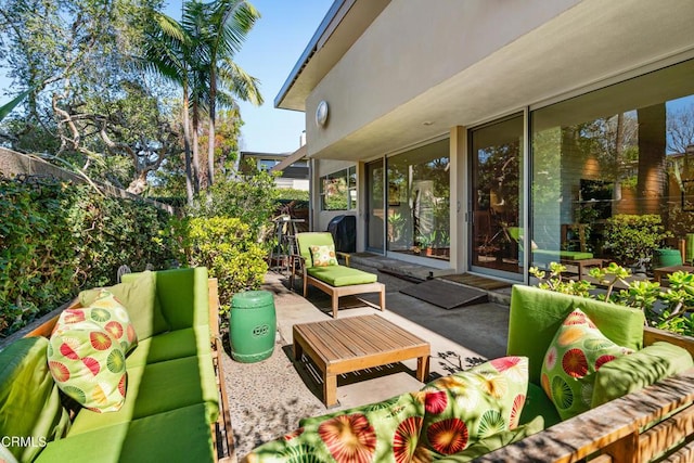 view of patio with fence and an outdoor hangout area