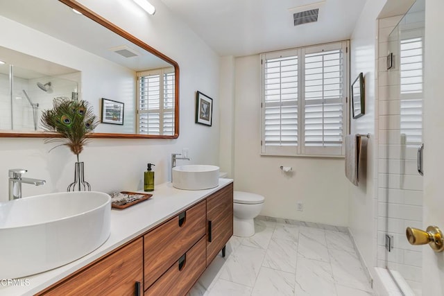 full bath featuring marble finish floor, a sink, and visible vents