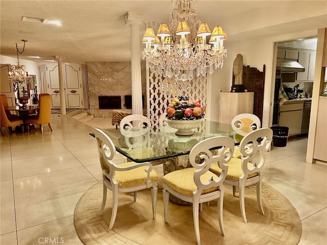 300 S Patencio Rd, Palm Springs, CA 92262 - dining area with a chandelier, light tile patterned floors, and a textured ceiling