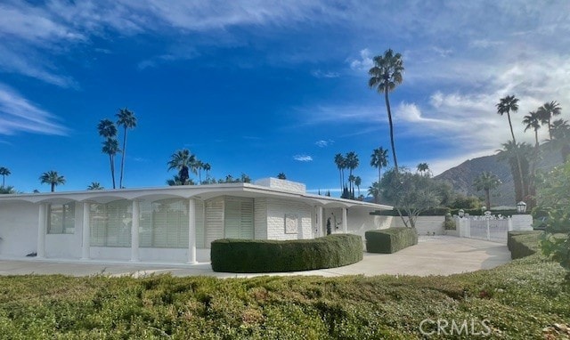 300 S Patencio Rd, Palm Springs, CA 92262 - view of home's exterior featuring a patio and a mountain view