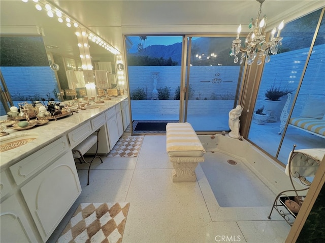 300 S Patencio Rd, Palm Springs, CA 92262 - full bathroom with vanity, a mountain view, a chandelier, and speckle patterned floor