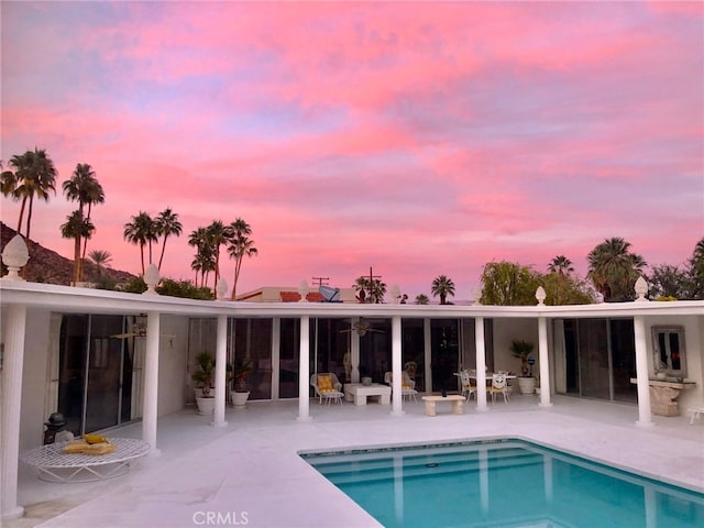 300 S Patencio Rd, Palm Springs, CA 92262 - back of house at dusk with a patio and an outdoor pool