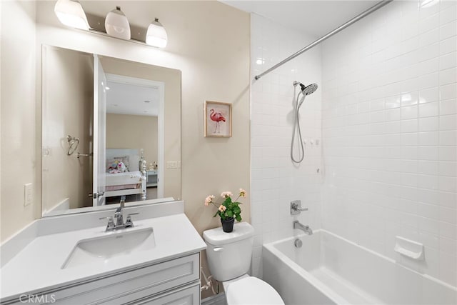 full bathroom with toilet, shower / bathtub combination, connected bathroom, and vanity