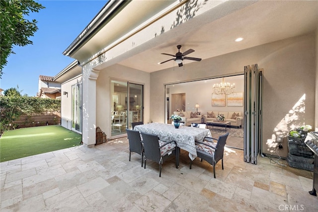 view of patio featuring ceiling fan and outdoor dining space