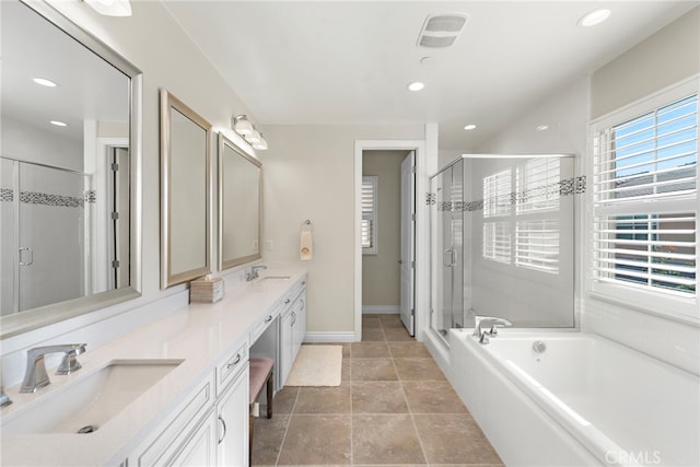 full bath with a stall shower, a garden tub, a sink, and double vanity