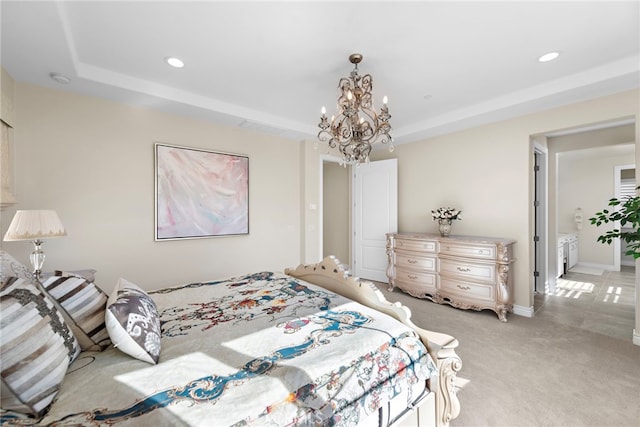 bedroom with a tray ceiling, recessed lighting, light carpet, a chandelier, and baseboards