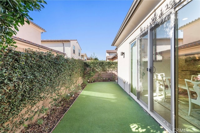 view of yard with a fenced backyard