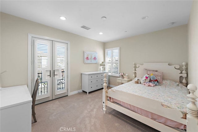 bedroom with access to outside, visible vents, light colored carpet, and french doors