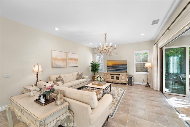 living area featuring a chandelier, recessed lighting, visible vents, and baseboards