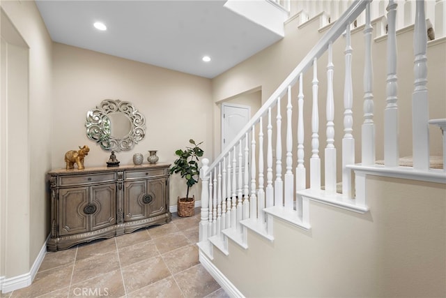 interior space featuring recessed lighting and baseboards