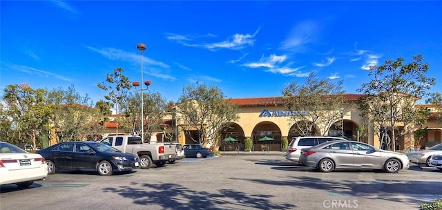 view of building exterior featuring uncovered parking