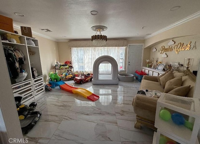 interior space with a textured ceiling, marble finish floor, ornamental molding, and visible vents