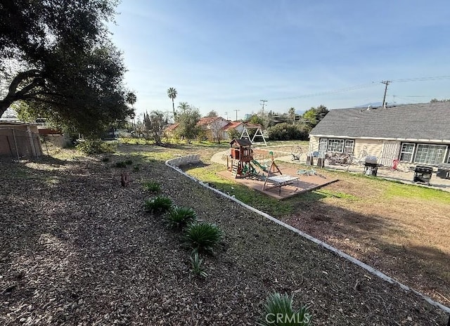 view of yard with a playground