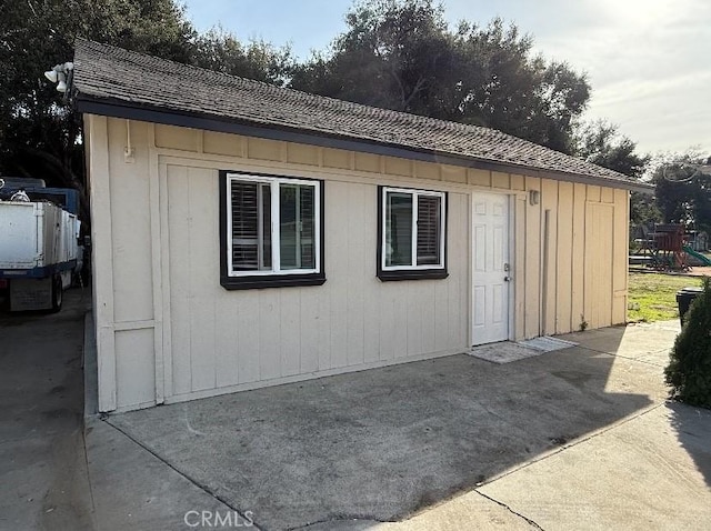 view of outbuilding featuring a playground