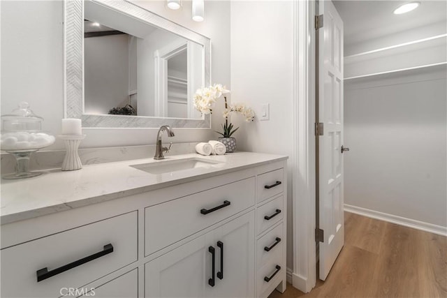 bathroom featuring vanity and wood finished floors