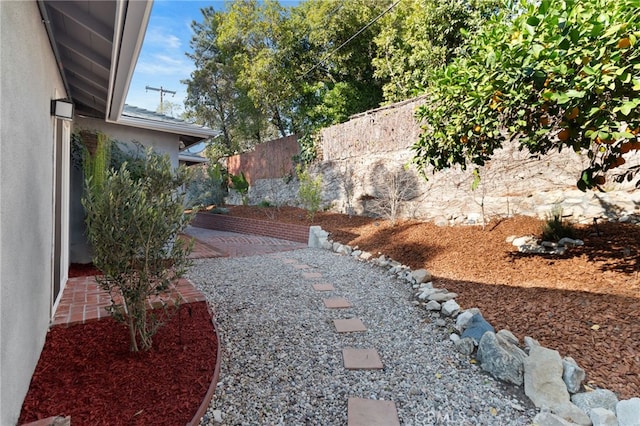 view of yard featuring a patio area and fence