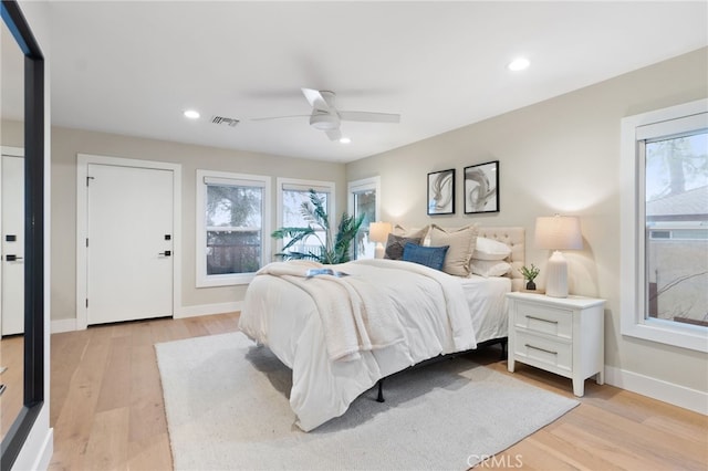 bedroom with visible vents, recessed lighting, light wood-style flooring, and baseboards