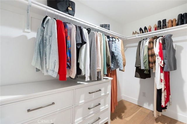 walk in closet featuring light wood finished floors