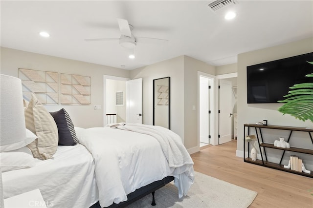 bedroom with recessed lighting, baseboards, visible vents, and light wood finished floors