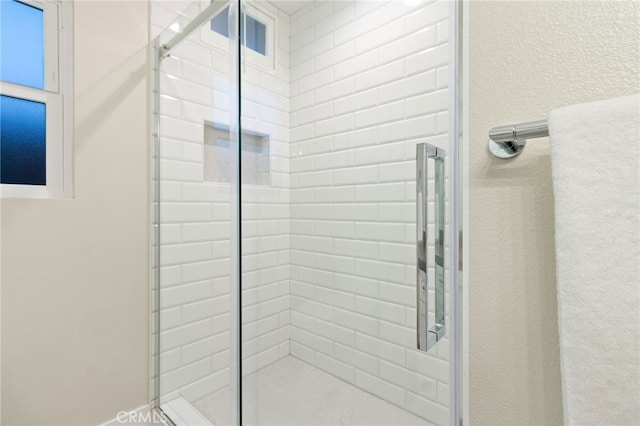 bathroom with a shower stall