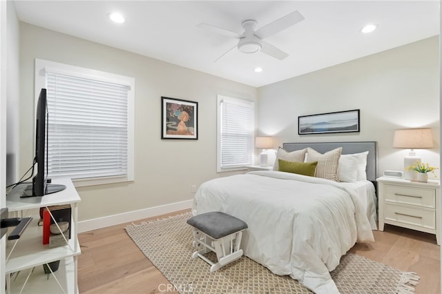 bedroom featuring light wood-style floors, recessed lighting, and baseboards