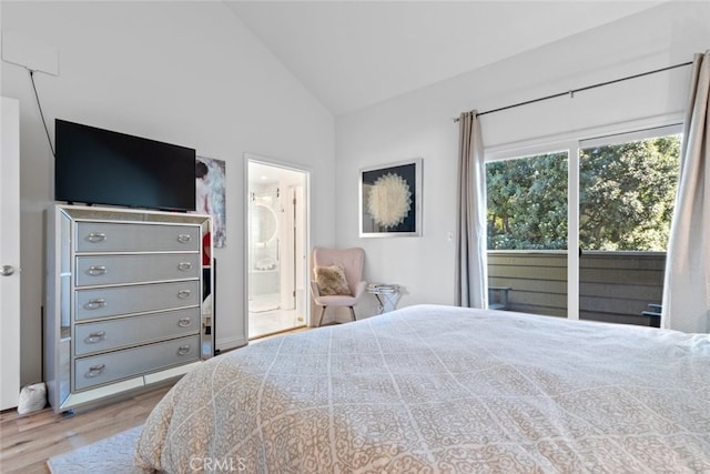 bedroom featuring connected bathroom, access to outside, vaulted ceiling, and wood finished floors