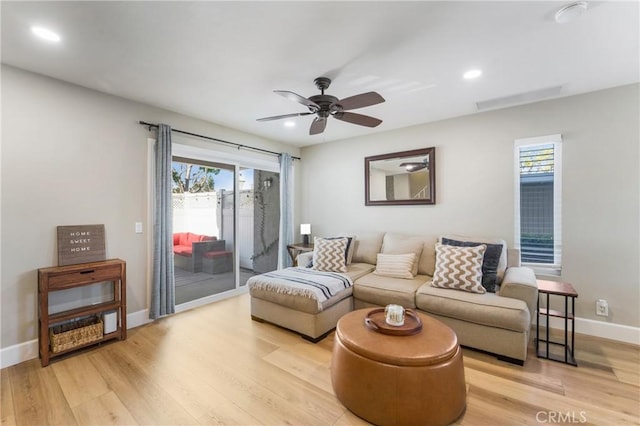 living room with light wood-type flooring, ceiling fan, baseboards, and recessed lighting