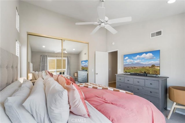 bedroom with ceiling fan, high vaulted ceiling, recessed lighting, visible vents, and a closet