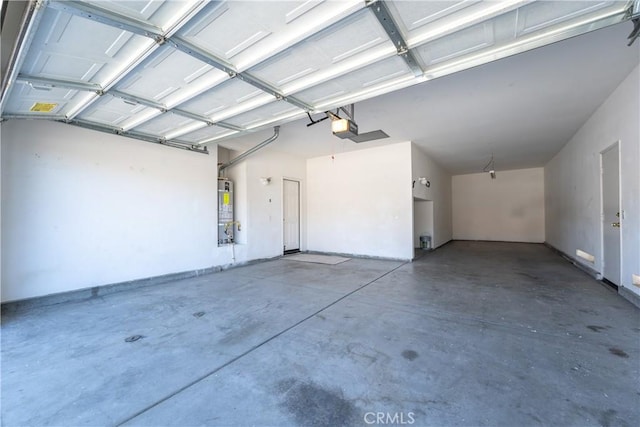 garage featuring secured water heater and a garage door opener