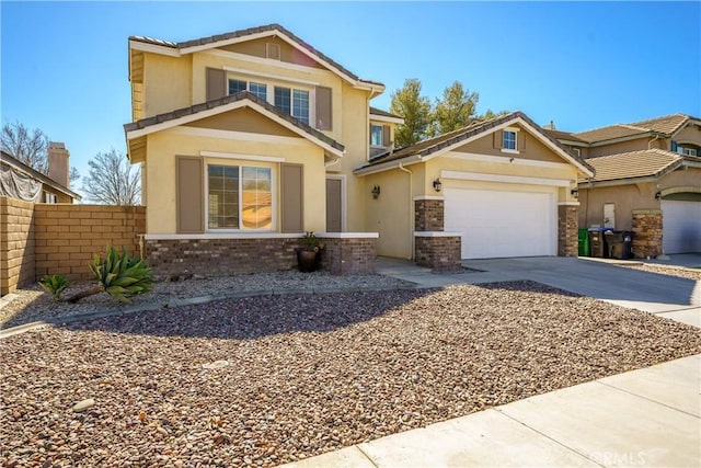 view of front of property featuring concrete driveway, stucco siding, an attached garage, fence, and brick siding