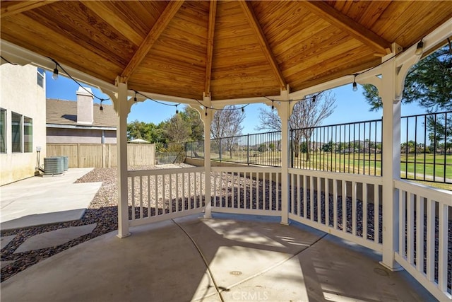 view of patio / terrace featuring a gazebo, fence, and central air condition unit