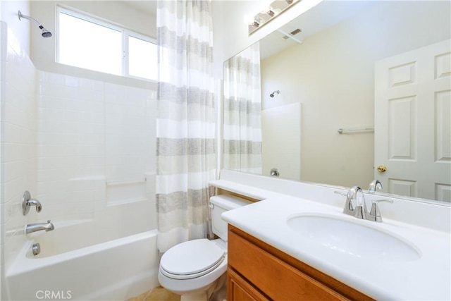 bathroom with vanity, toilet, and shower / tub combo with curtain