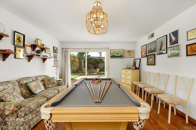 playroom featuring a chandelier, wood finished floors, and visible vents