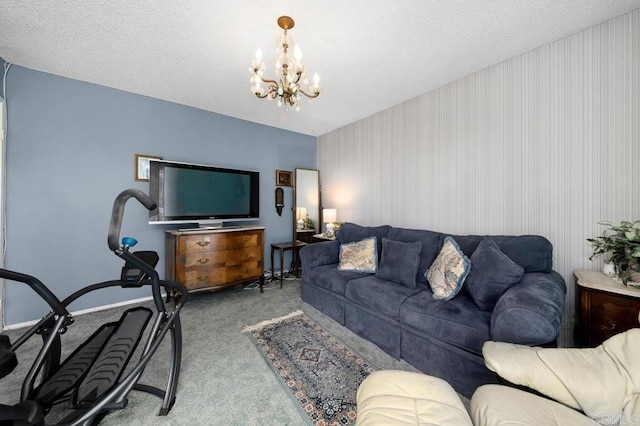 living area with carpet floors, a textured ceiling, and a notable chandelier