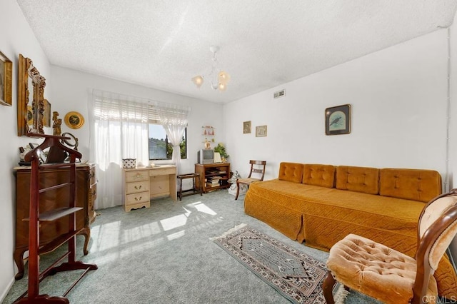 interior space featuring carpet, visible vents, and a textured ceiling