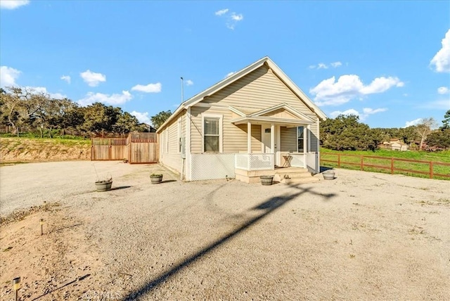 view of front of house featuring fence