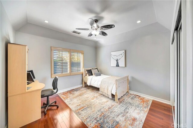 bedroom with visible vents, baseboards, recessed lighting, dark wood-type flooring, and vaulted ceiling