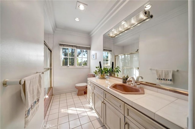 full bathroom with toilet, ornamental molding, vanity, tile patterned flooring, and baseboards