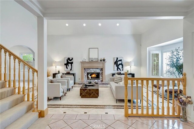 living area featuring recessed lighting, tile patterned floors, a wealth of natural light, and a fireplace