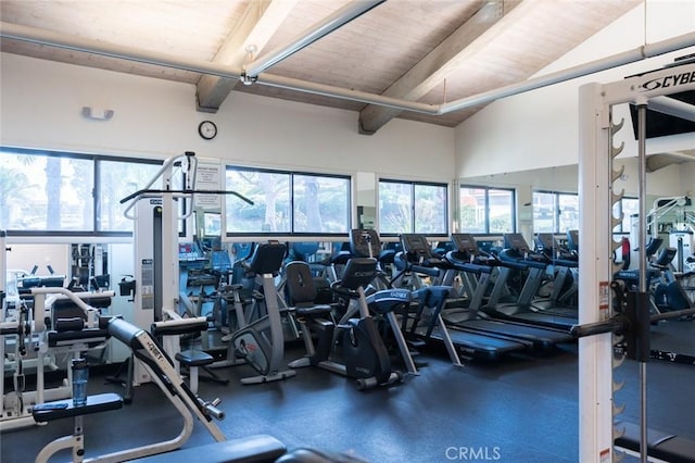 exercise room featuring wooden ceiling and vaulted ceiling